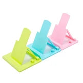 Adjustable Universal Plastic Phone Holder for Smartphones and Tablets