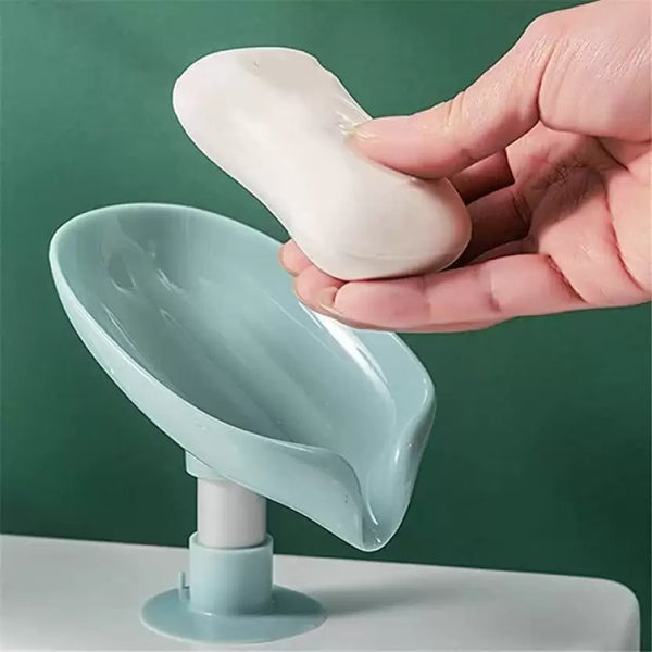 Self-draining soap holder with suction base